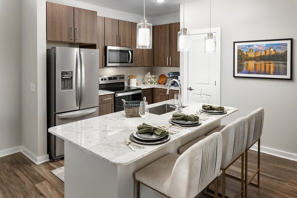 Overture Powers Ferry Apartments: Modern kitchen with stainless steel appliances and granite countertops