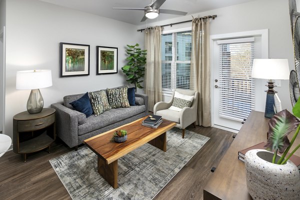 Spacious living room with contemporary furnishings at Overture Powers Ferry Apartments in Atlanta