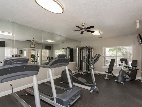 Fully-equipped fitness center with state-of-the-art machines at Avana Bellevue Apartments, offering residents diverse exercise options