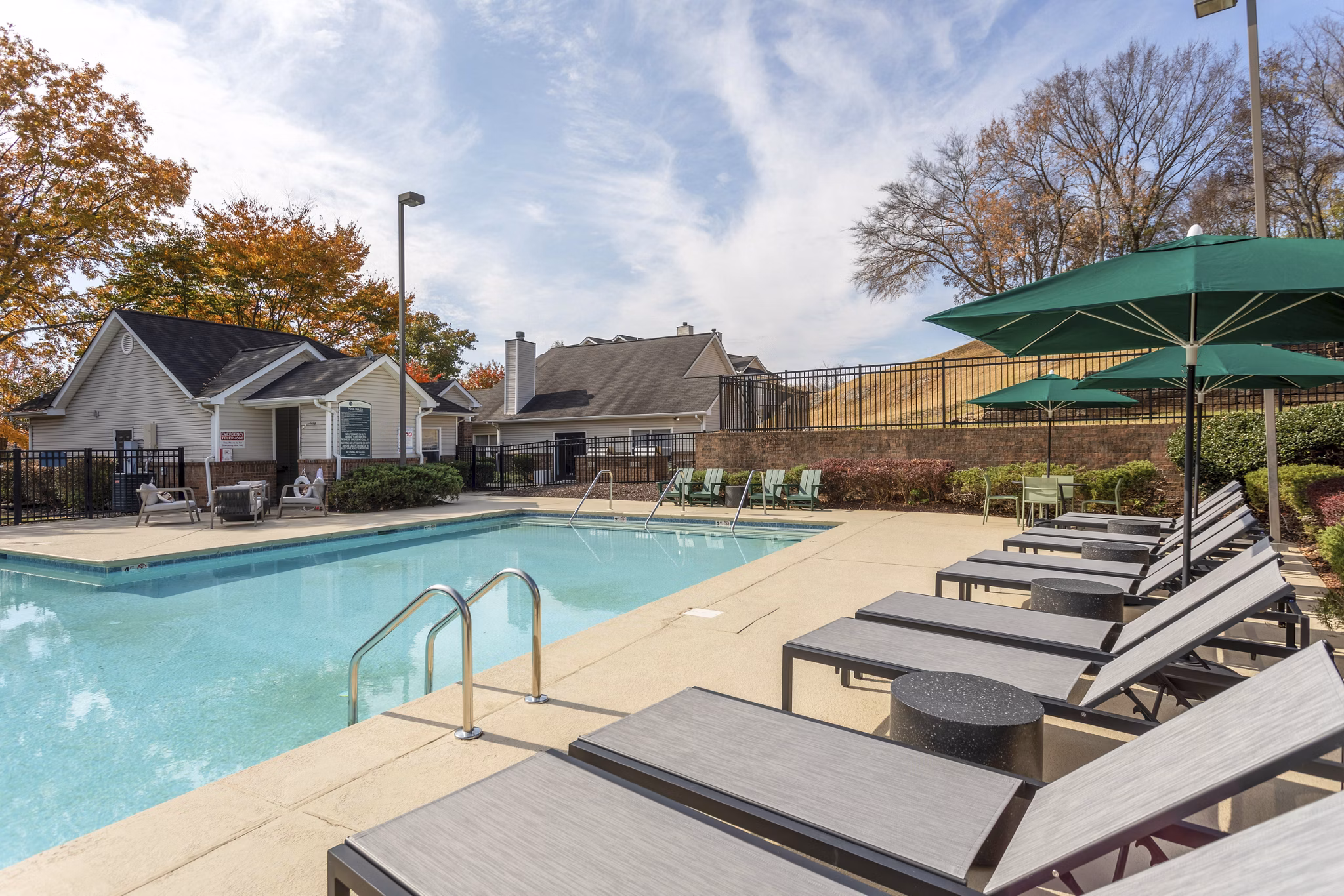 Infinity edge pool with lounge chairs at Avana Bellevue Apartments, offering luxury living near shopping and dining in vibrant Bellevue