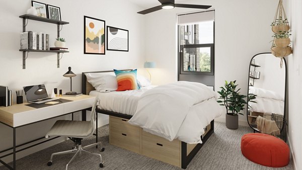 Modern bedroom featuring elegant decor and natural light at The Parlor Apartments