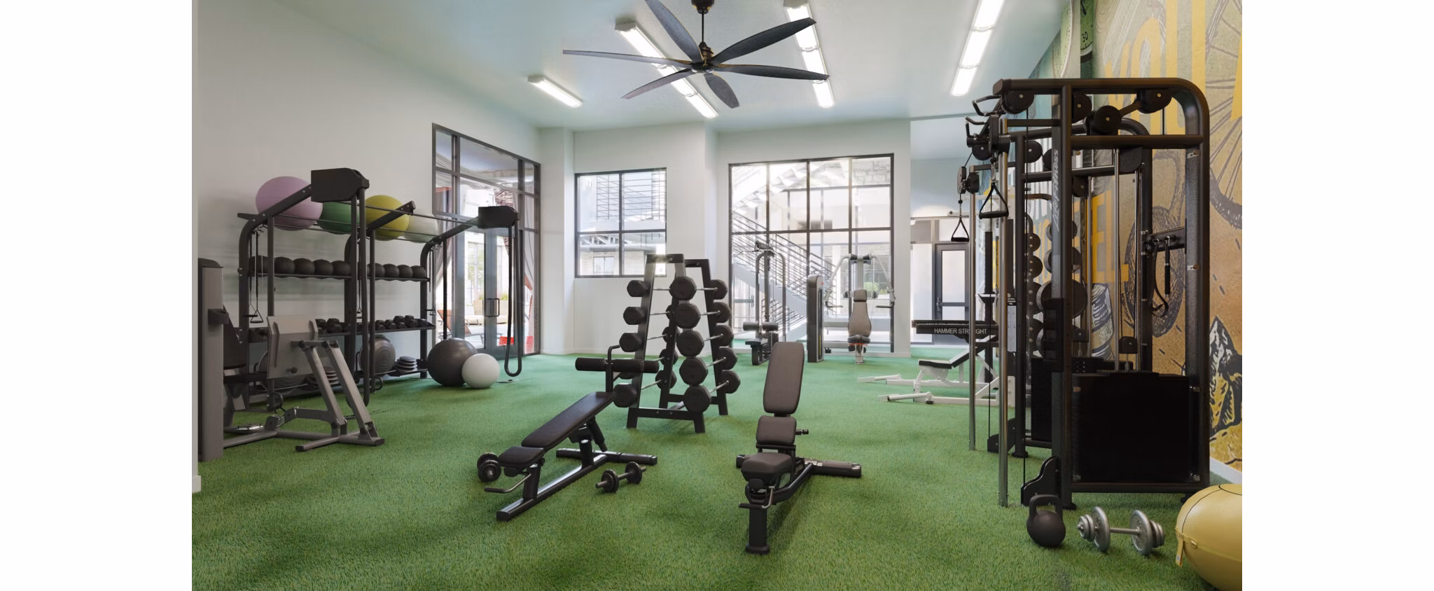 Fitness center with modern equipment at The Parlor Apartments, offering luxury living and wellness amenities for residents
