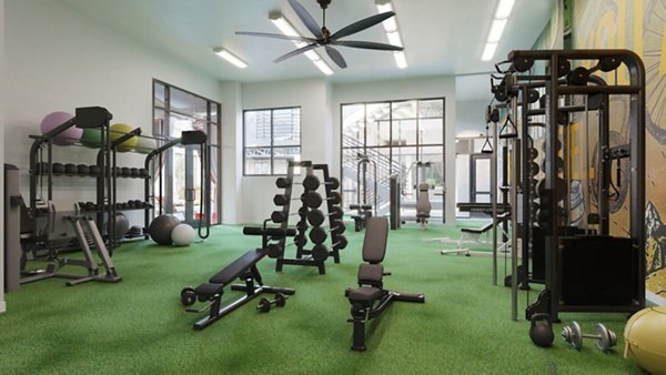Fitness center with modern equipment at The Parlor Apartments, offering luxury living and wellness amenities for residents