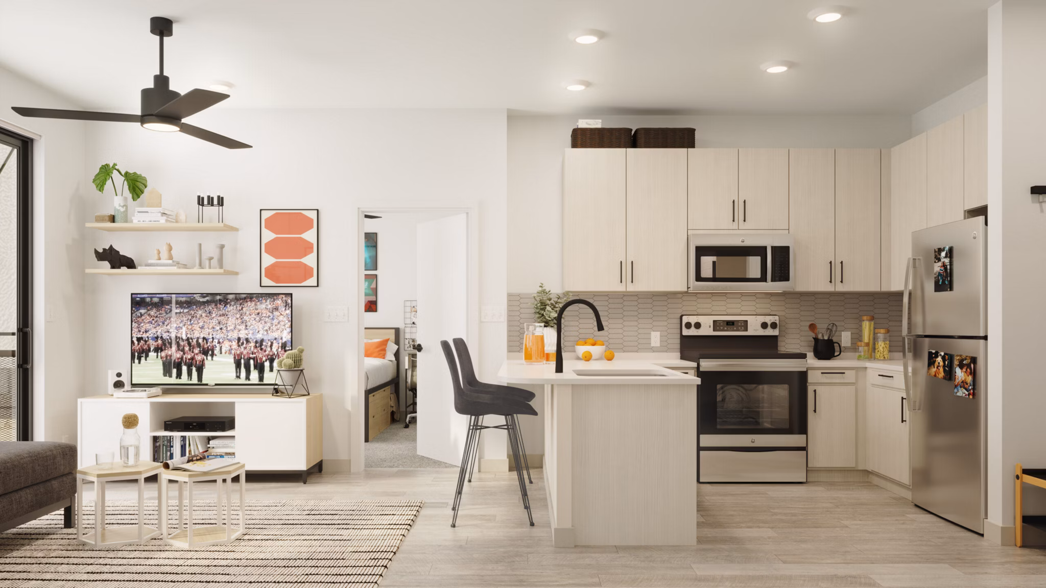 Modern kitchen featuring marble countertops and stainless steel appliances at The Parlor Apartments