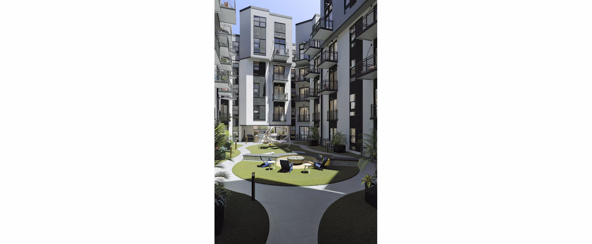The Parlor Apartments: Lush courtyard with modern seating and greenery, perfect for relaxation and social gatherings in a serene environment