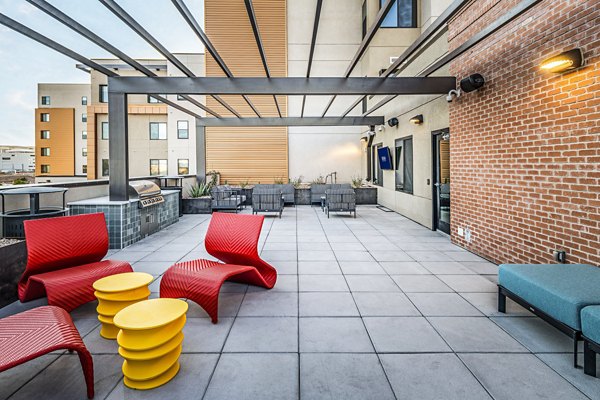 Outdoor grill area with modern appliances at Union on 6th Apartments, ideal for hosting summer BBQs and gatherings