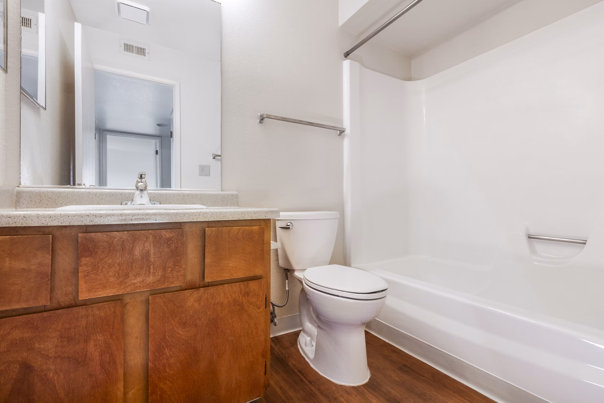 Modern bathroom with sleek fixtures and stylish vanity at Schoonover Park Apartments