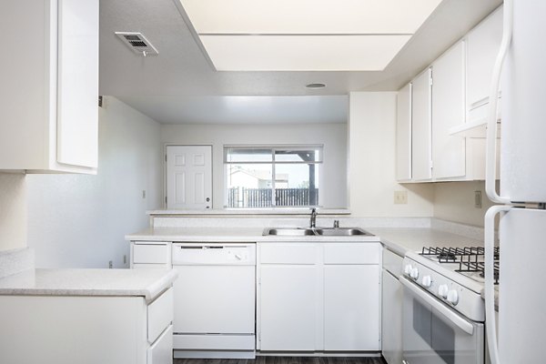 Modern kitchen with stainless steel appliances at Schoonover Park Apartments