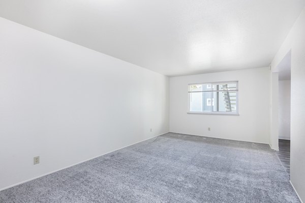 Spacious living room with modern furnishings at Schoonover Park Apartments, perfect for luxury living in Greystar communities