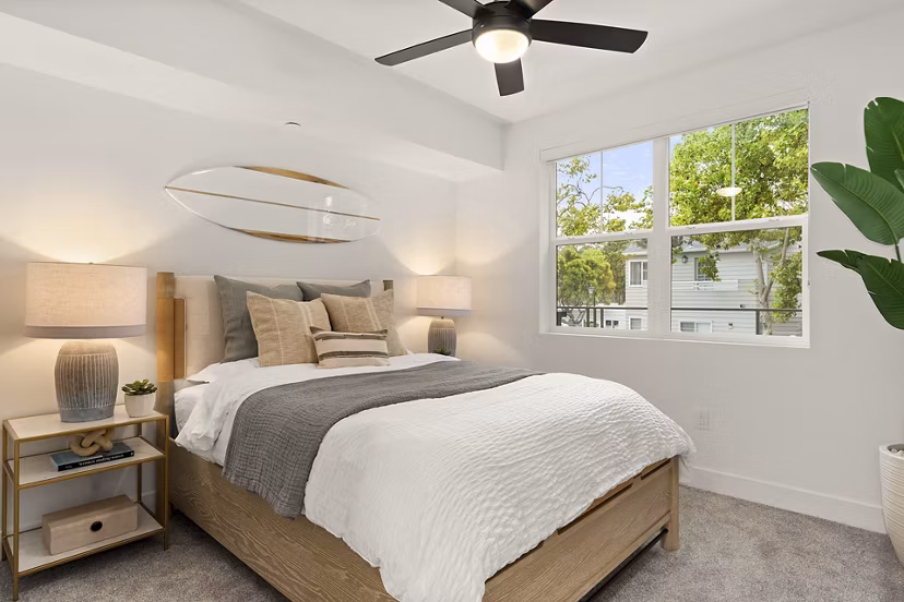 Bedroom with modern decor and large windows at Colony Parc Apartments, Greystar luxury community in San Luis Obispo