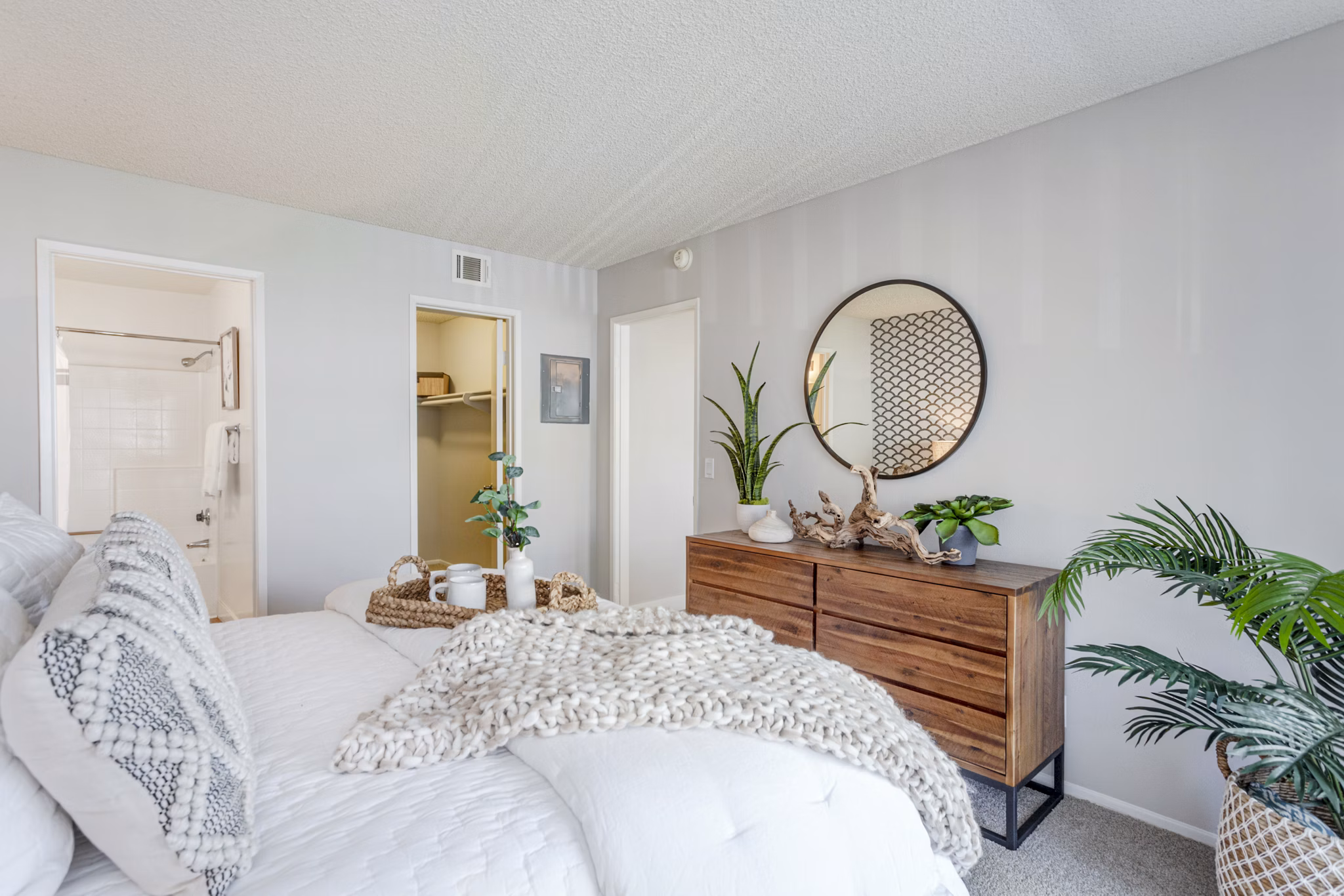 Bedroom with stylish decor and ample natural light at Colony Parc Apartments