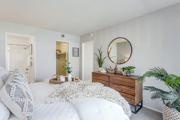 Bedroom with stylish decor and ample natural light at Colony Parc Apartments