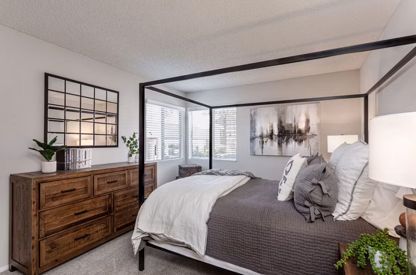 Chic bedroom with elegant decor and natural light at Colony Parc Apartments luxury living