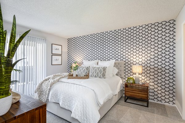 Chic bedroom with elegant decor and natural light at Colony Parc Apartments luxury living
