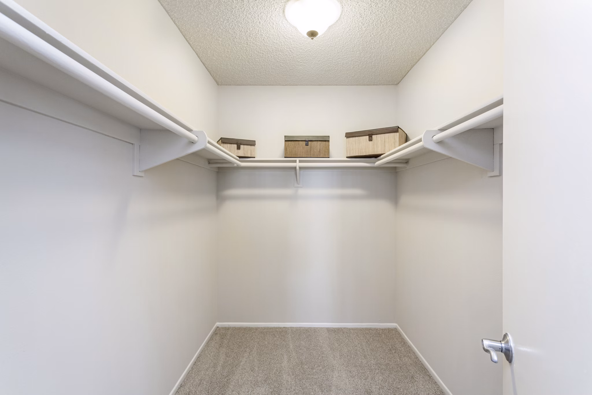 Walk-in closet with ample storage in Colony Parc Apartments