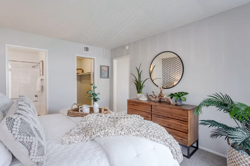 Walk-in closet with built-in shelving in Colony Parc Apartments