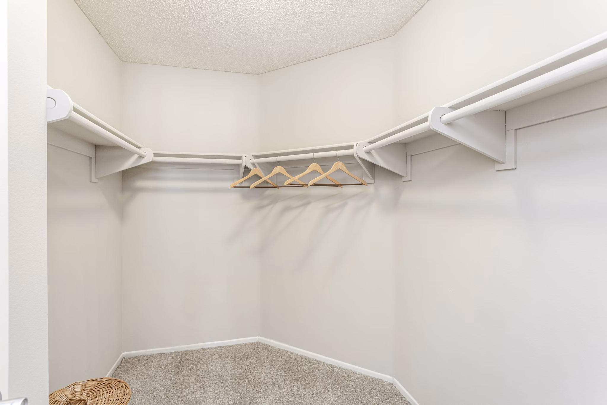 Walk-in closet with built-in shelving in Colony Parc Apartments
