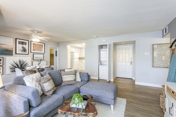 Spacious living room with modern furnishings at Colony Parc Apartments, luxury Greystar property