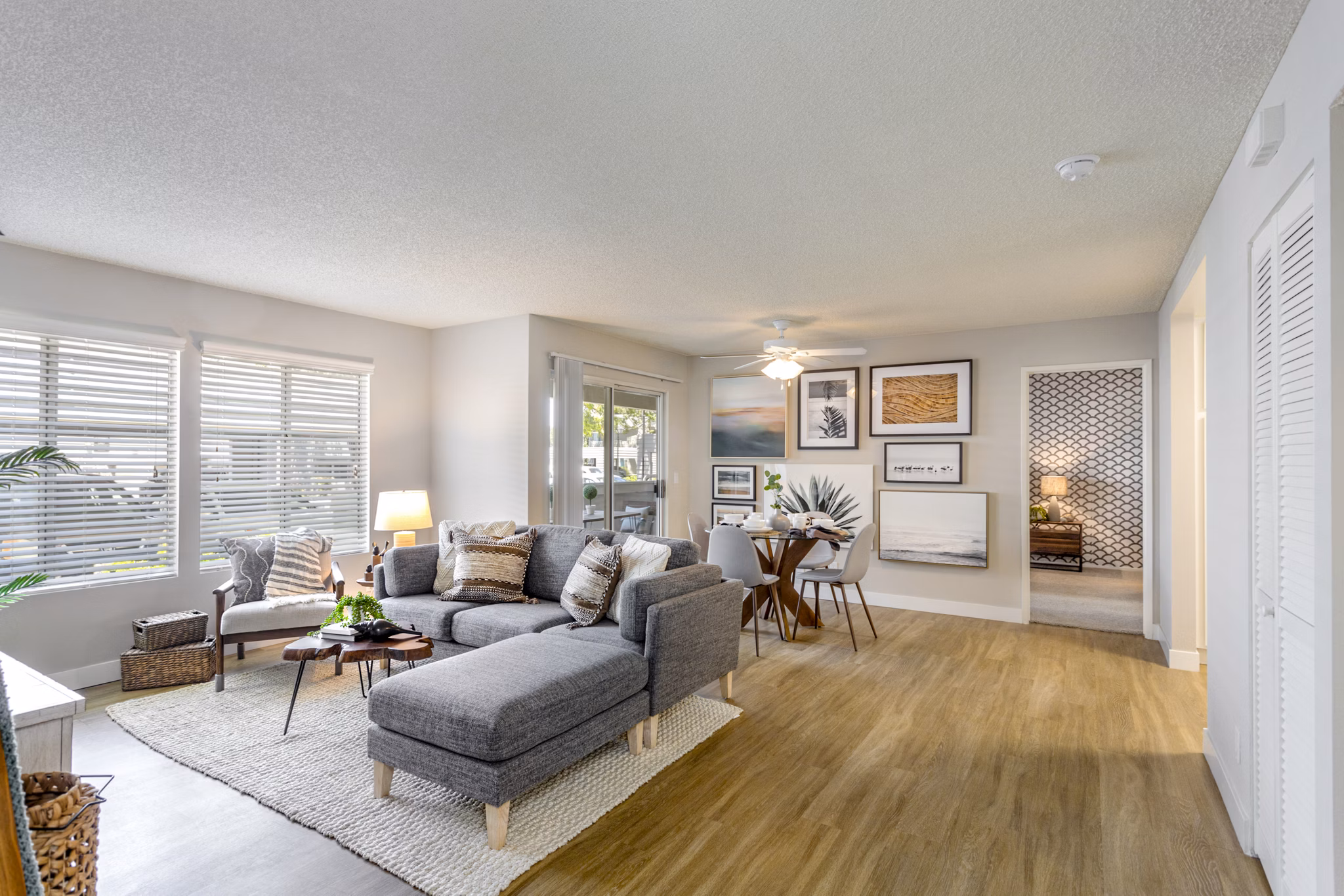 Spacious living room with hardwood floors and modern decor in Colony Parc Apartments