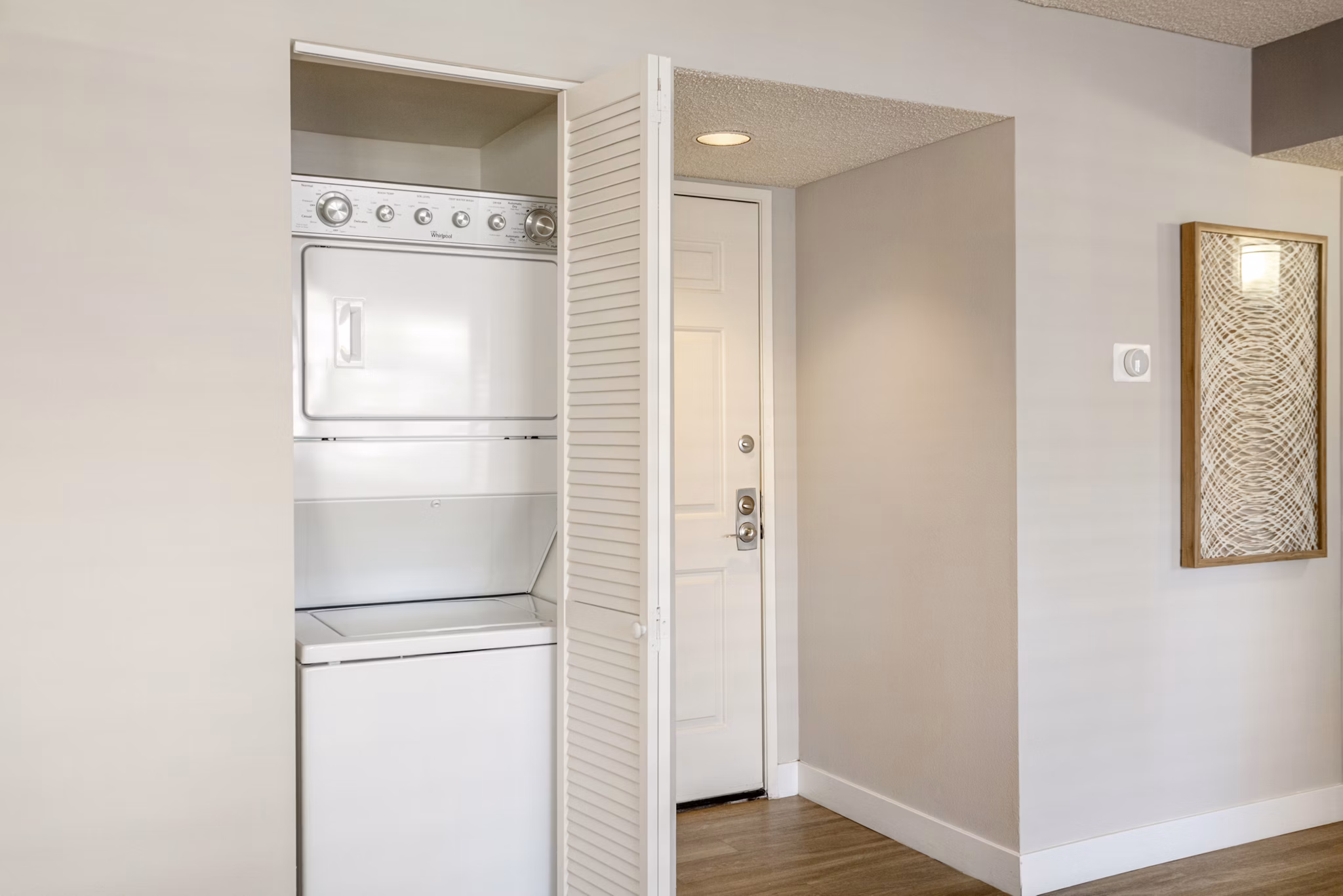 Laundry room with modern appliances at Colony Parc Apartments for Greystar luxury living