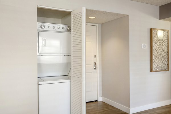 Laundry room with modern appliances at Colony Parc Apartments for Greystar luxury living