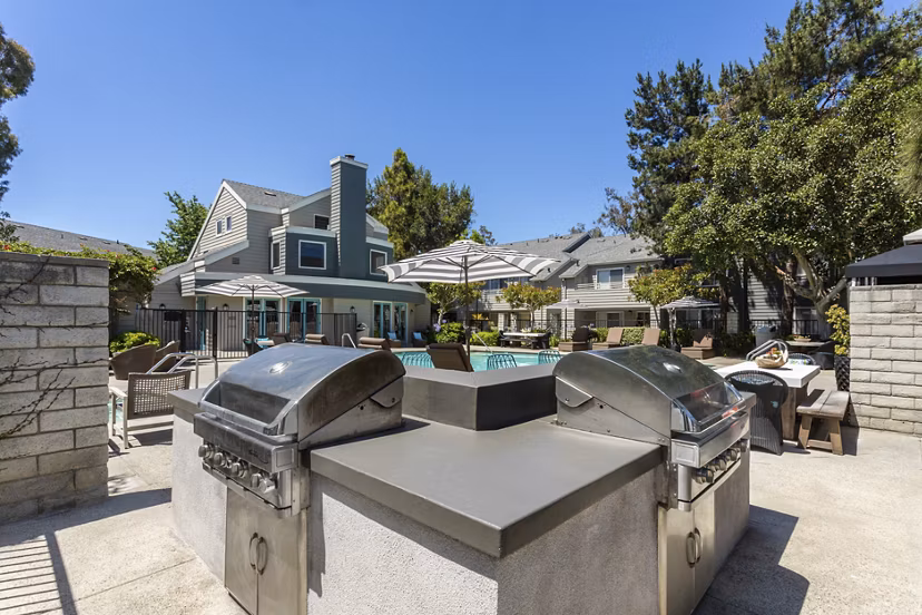 Colony Parc Apartments: Cozy fire pit on a stylish outdoor patio, perfect for relaxing evenings
