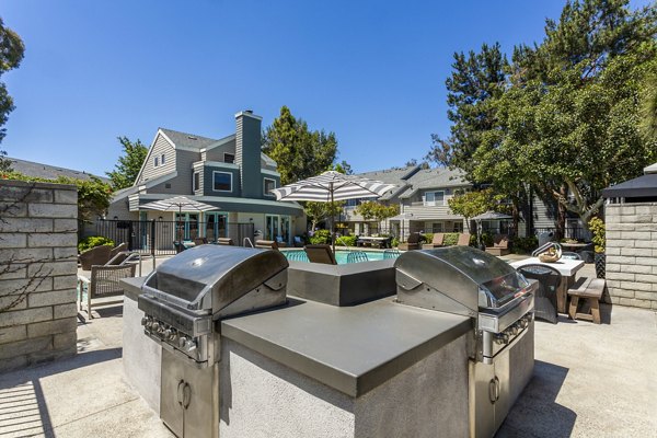 Grill area with modern BBQ facilities at Colony Parc Apartments