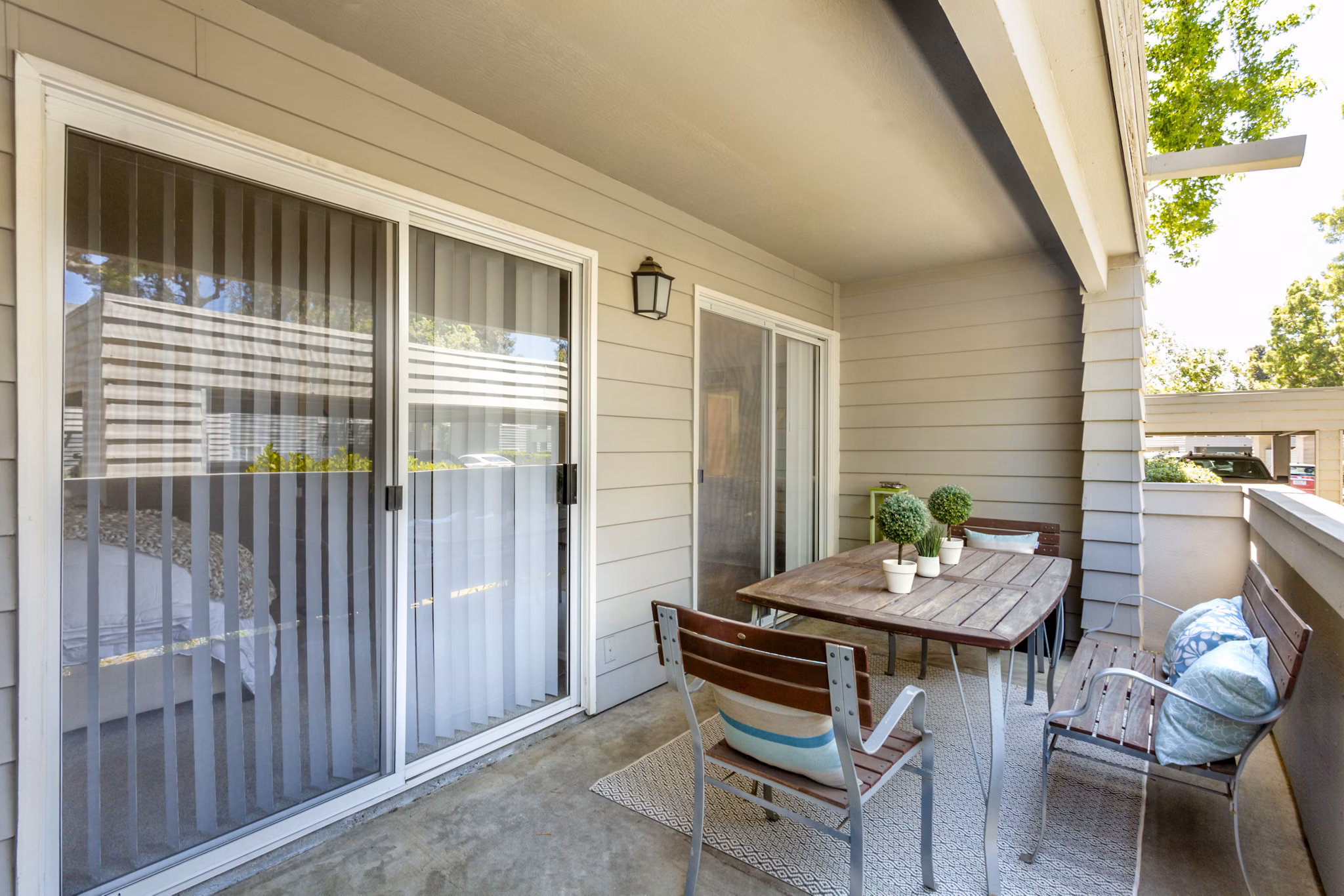 Spacious patio with modern seating at Colony Parc Apartments in a tranquil setting