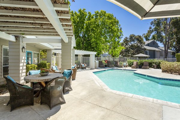 Pool patio with lush landscaping at Colony Parc Apartments in San Luis Obispo, offering luxury outdoor living spaces for relaxation
