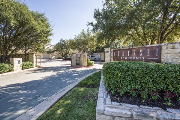 Somerset Townhomes entrance sign with lush landscaping
