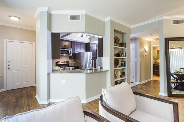 Modern kitchen featuring stainless steel appliances and granite countertops at Somerset Townhomes