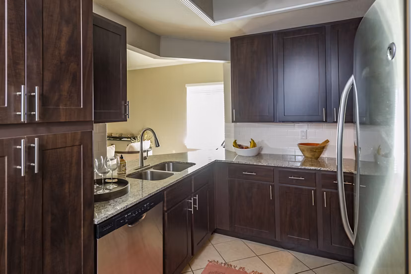 Modern kitchen with stainless steel appliances at Somerset Townhomes