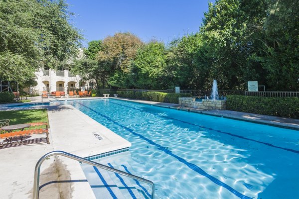 Inviting outdoor pool area at Somerset Townhomes with comfortable loungers for relaxation