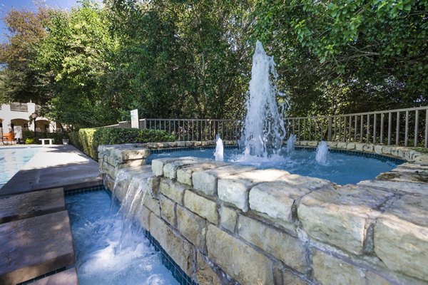 Outdoor swimming pool at Somerset Townhomes featuring lounge chairs and landscaped surroundings