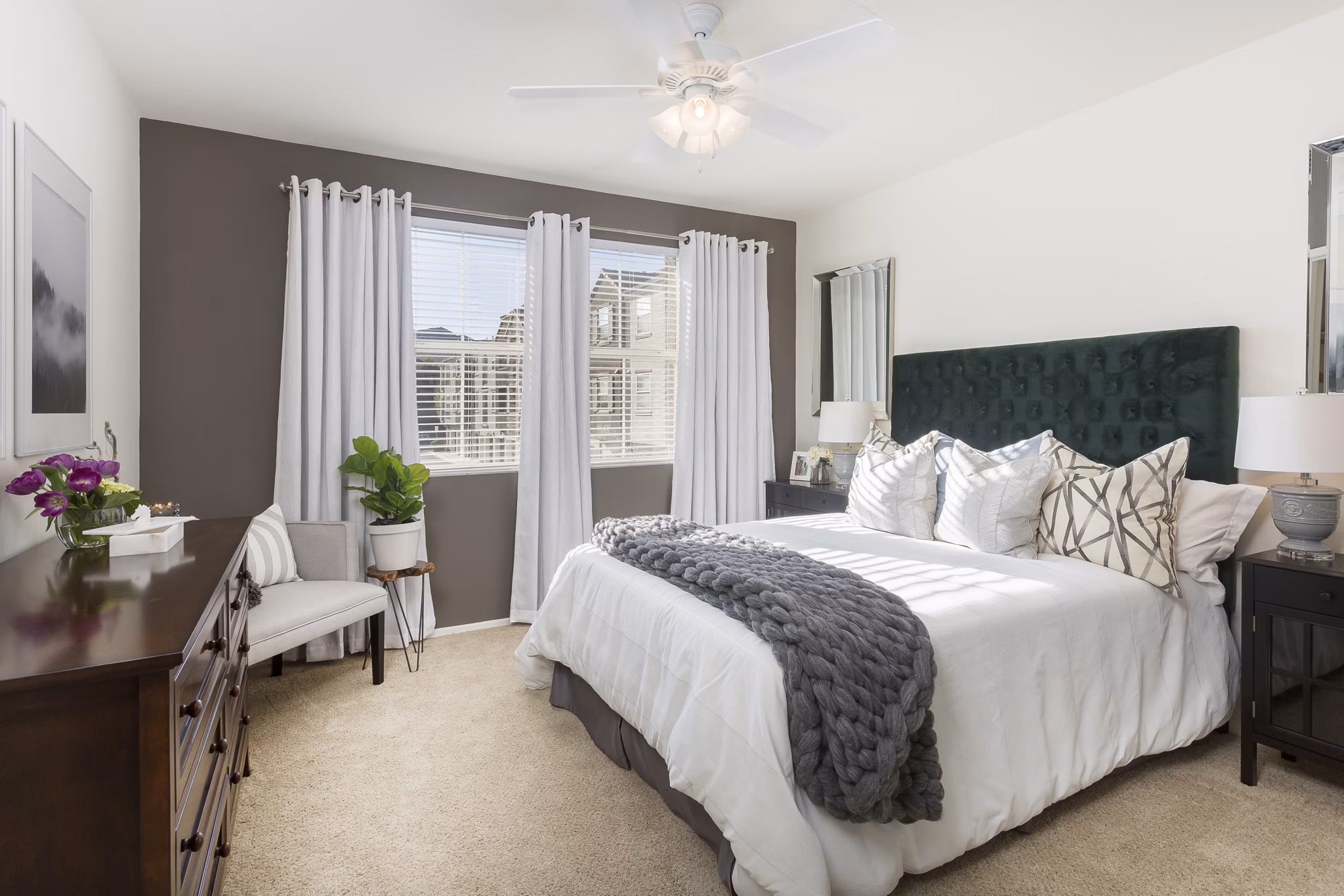 Elegant bedroom with plush bedding at Parc Chateaux Apartments, a luxury living destination