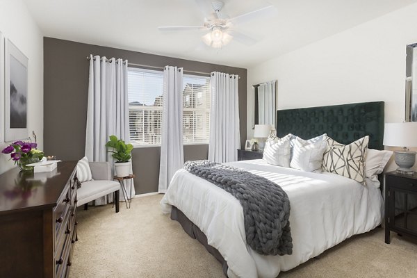 Elegant bedroom with plush bedding at Parc Chateaux Apartments, a luxury living destination
