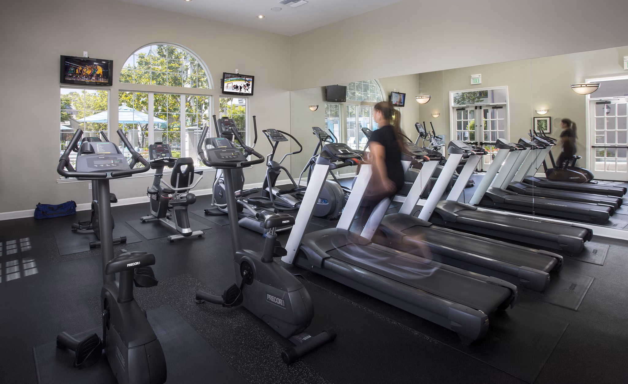 Modern fitness center with state-of-the-art equipment at Parc Chateaux Apartments, ideal for luxury living and wellness