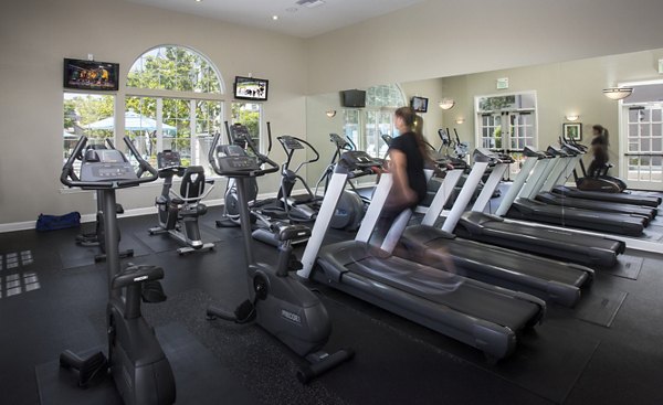 Modern fitness center with state-of-the-art equipment at Parc Chateaux Apartments, ideal for luxury living and wellness