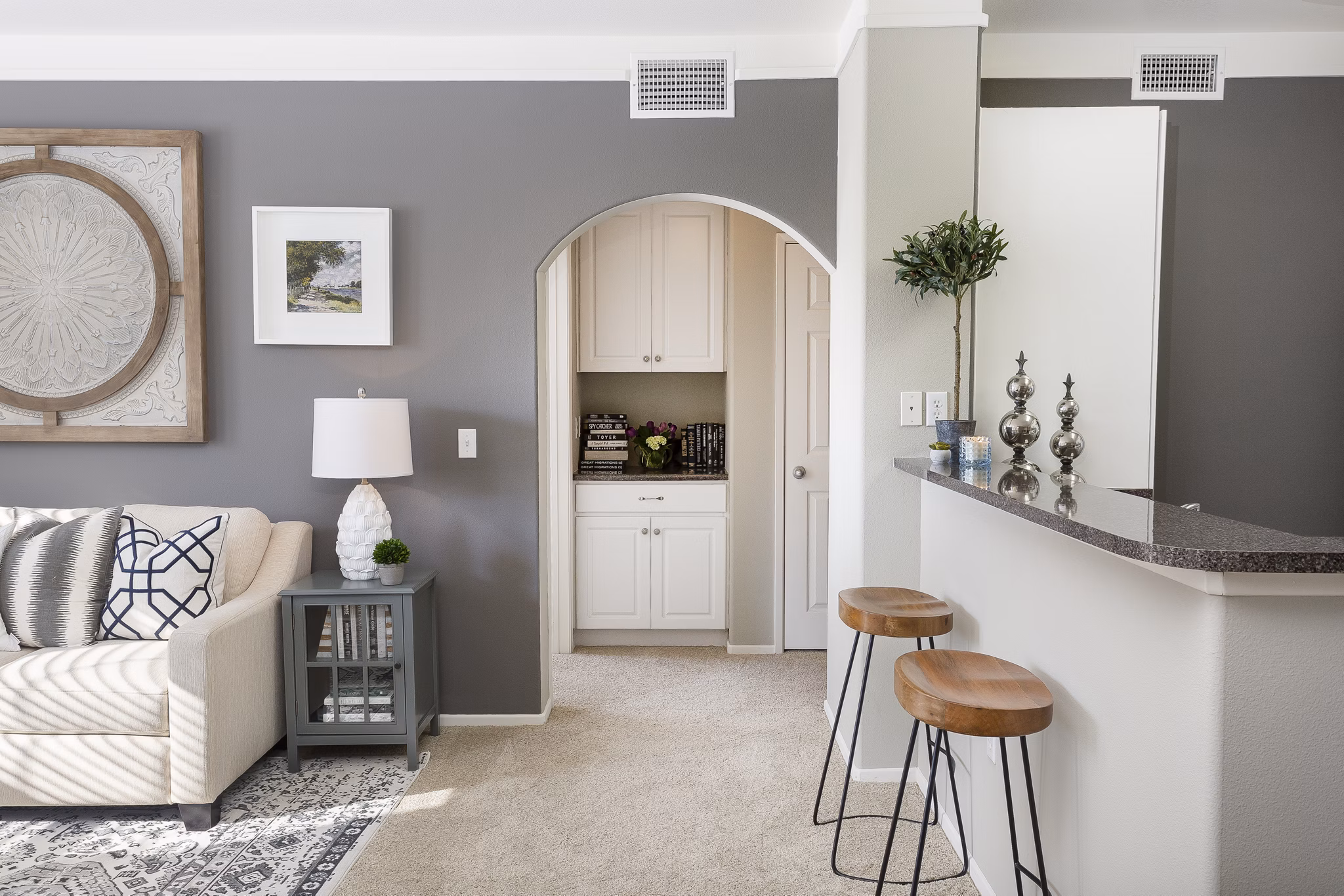 Elegant kitchen with granite countertops and stainless steel appliances in Parc Chateaux Apartments