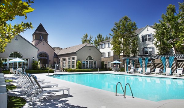 Olympic-sized pool at Parc Chateaux Apartments featuring luxury amenities and relaxation spaces
