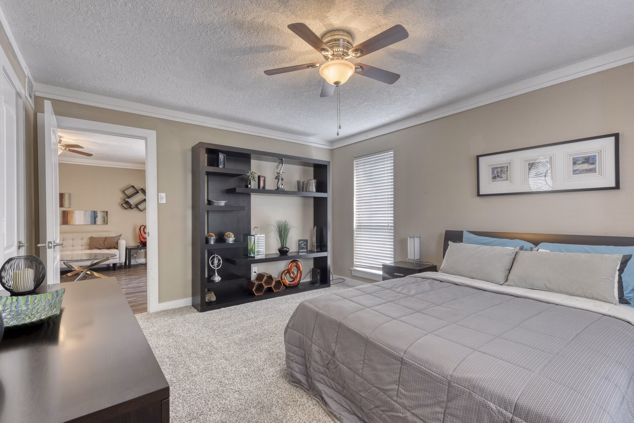 Modern bedroom featuring plush bedding at Stone Chase Apartments, ideal for comfort and relaxation
