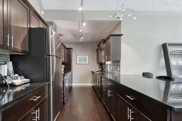 Stone Chase Apartments: Modern clubhouse featuring stylish seating and a fireplace
