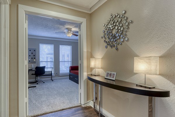 Hallway featuring modern lighting and sleek design in Stone Chase Apartments