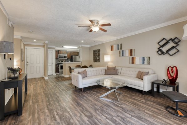 Spacious living room with modern dÃ©cor at Stone Chase Apartments in prime location, perfect for luxury living