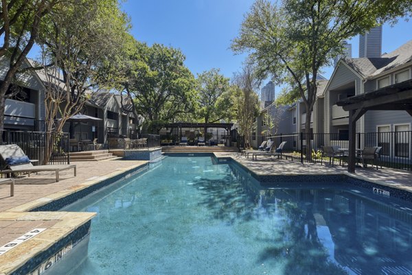 Crystal-clear community pool at Stone Chase Apartments offering a relaxing oasis for residents