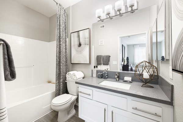 Modern bathroom with sleek fixtures at Mission Grove Park Apartments, a luxury residence by Greystar