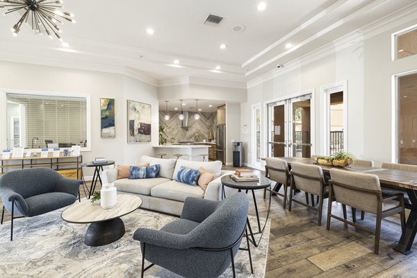 Clubhouse featuring modern design and spacious seating at Mission Grove Park Apartments