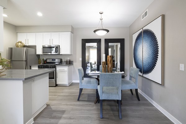 Dining room with modern furnishings and elegant lighting at Mission Grove Park Apartments