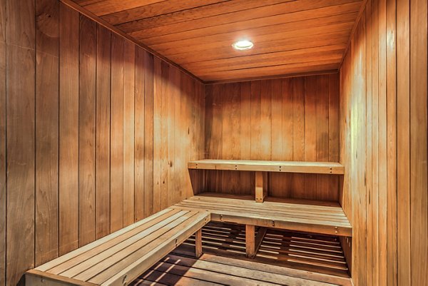 Relaxing sauna at Mission Grove Park Apartments with warm wood interiors, offering a luxurious wellness amenity for residents at this premium property