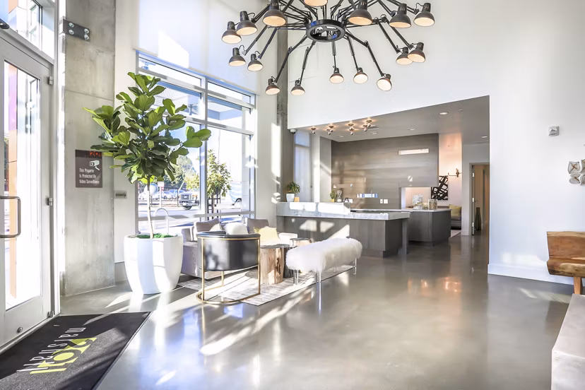 Contemporary clubhouse at 201 Marshall Apartments featuring stylish seating and a stunning fireplace